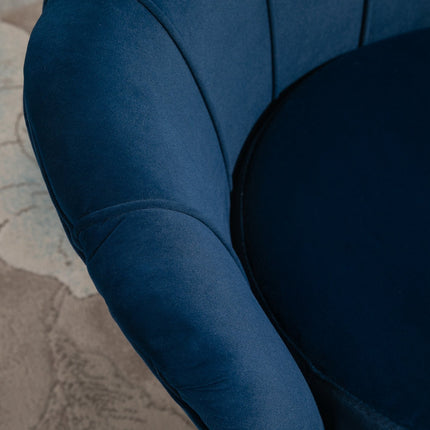 Blue shell-shaped upholstered velvet armchair with metal legs