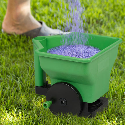 Hand spreader for fertilizer and seed