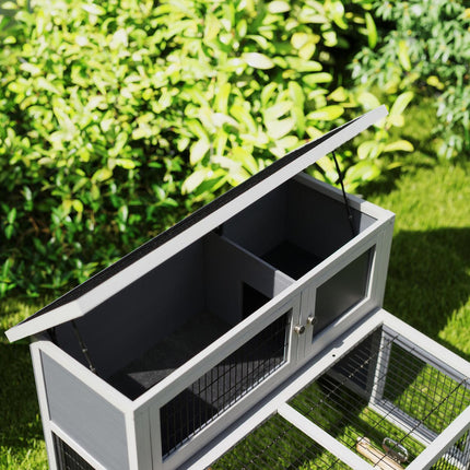 Two-story rabbit hutch with outdoor enclosure